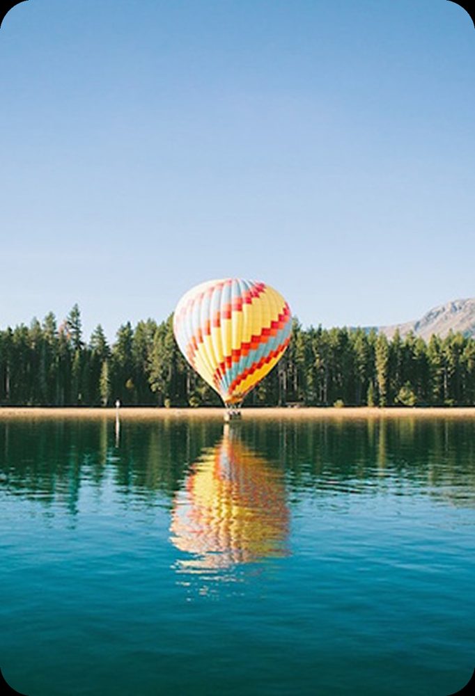 Lake scene with a hot air balloon before erasing